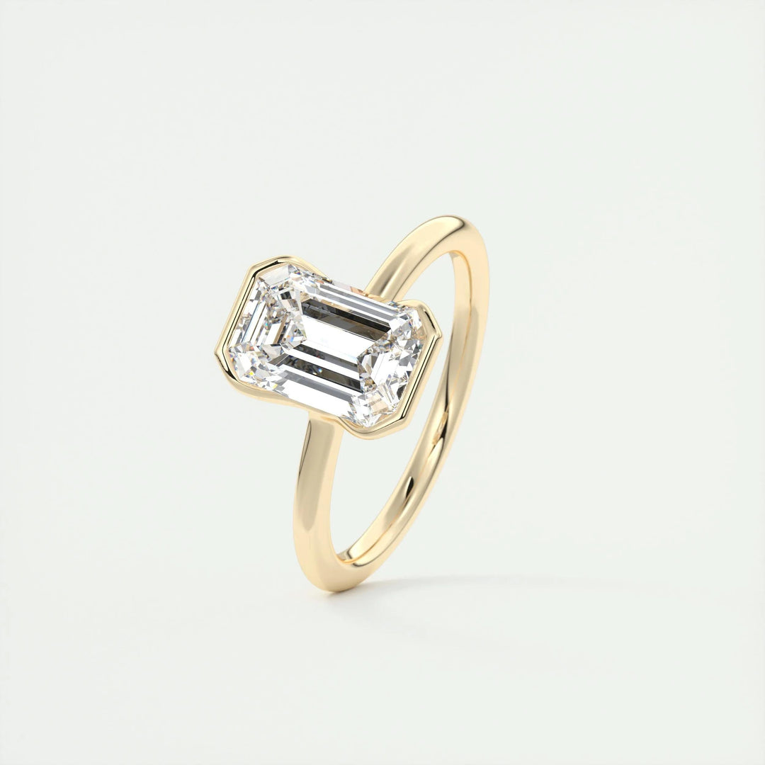 Emerald solitaire engagement ring close-up highlighting diamond sparkle