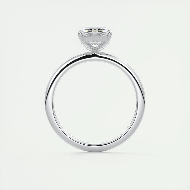 Emerald solitaire engagement ring with brilliant diamond sparkle