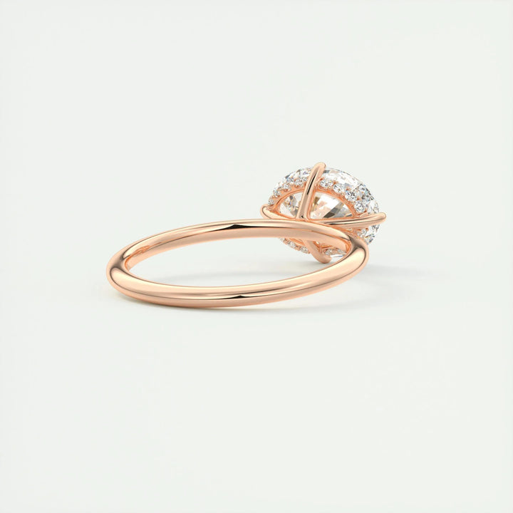 Oval hidden halo diamond ring displayed on jewelry stand
