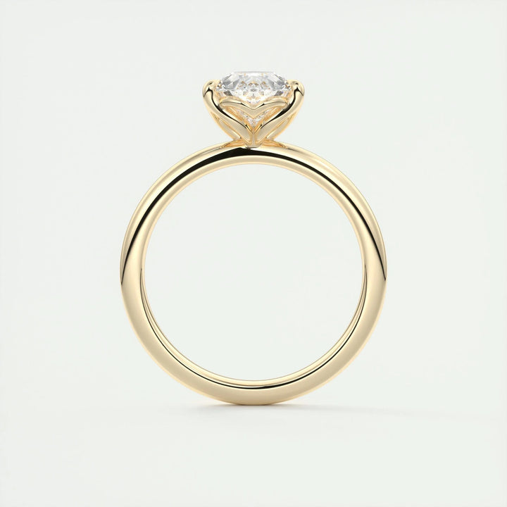 Pear solitaire engagement ring finished in polished solid gold