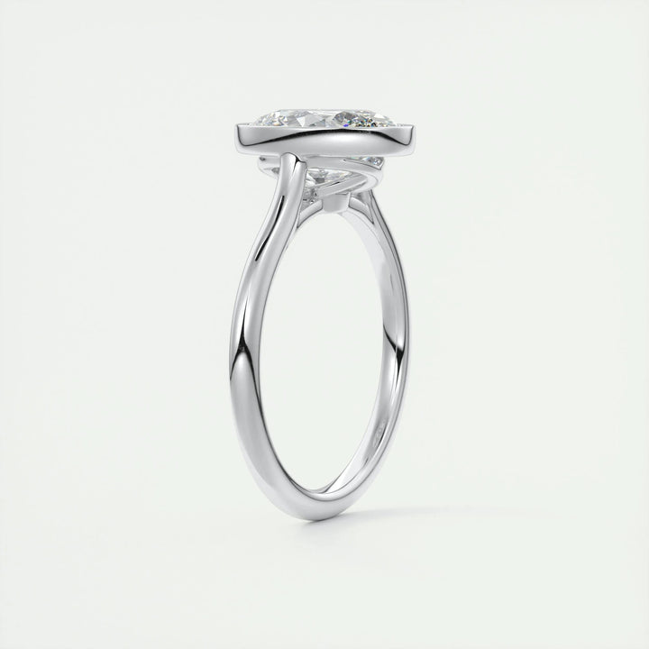 Oval bezel lab grown diamond ring fitted on finger