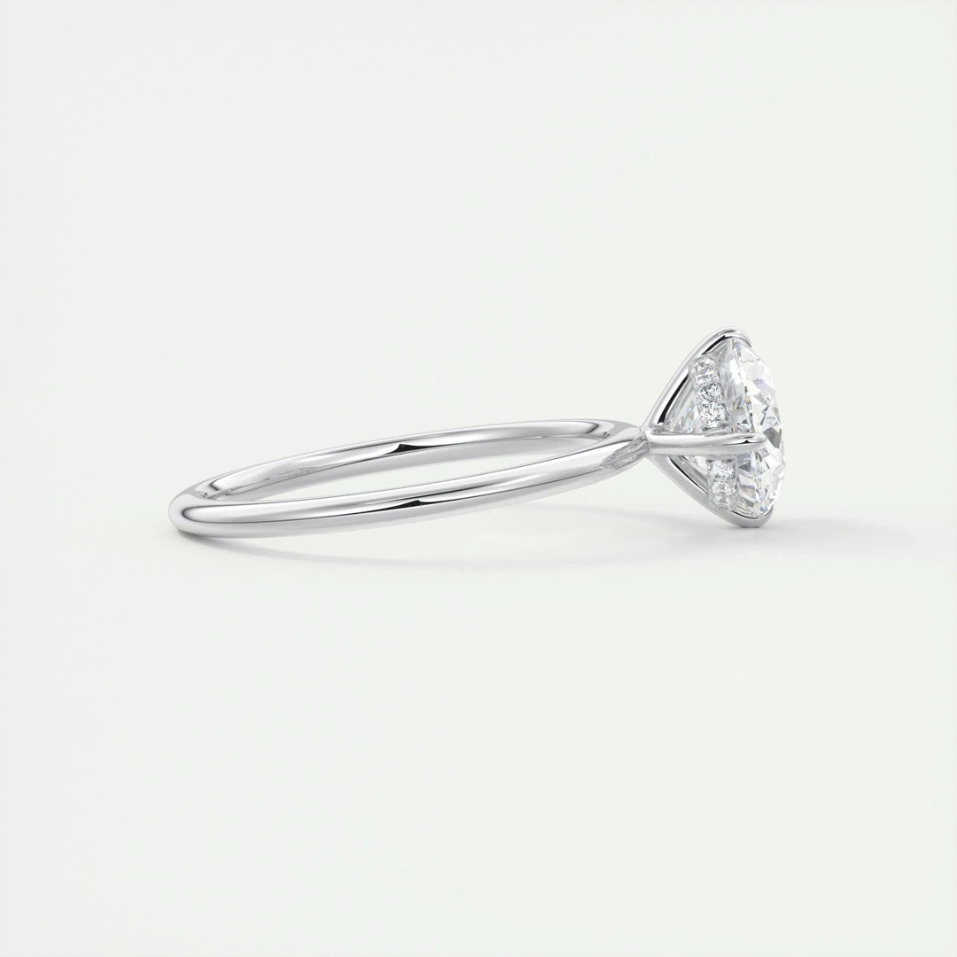 Oval hidden halo engagement ring offered in gold and platinum