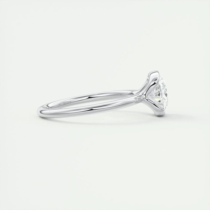 IGI certified oval cut diamond in bezel engagement ring setting