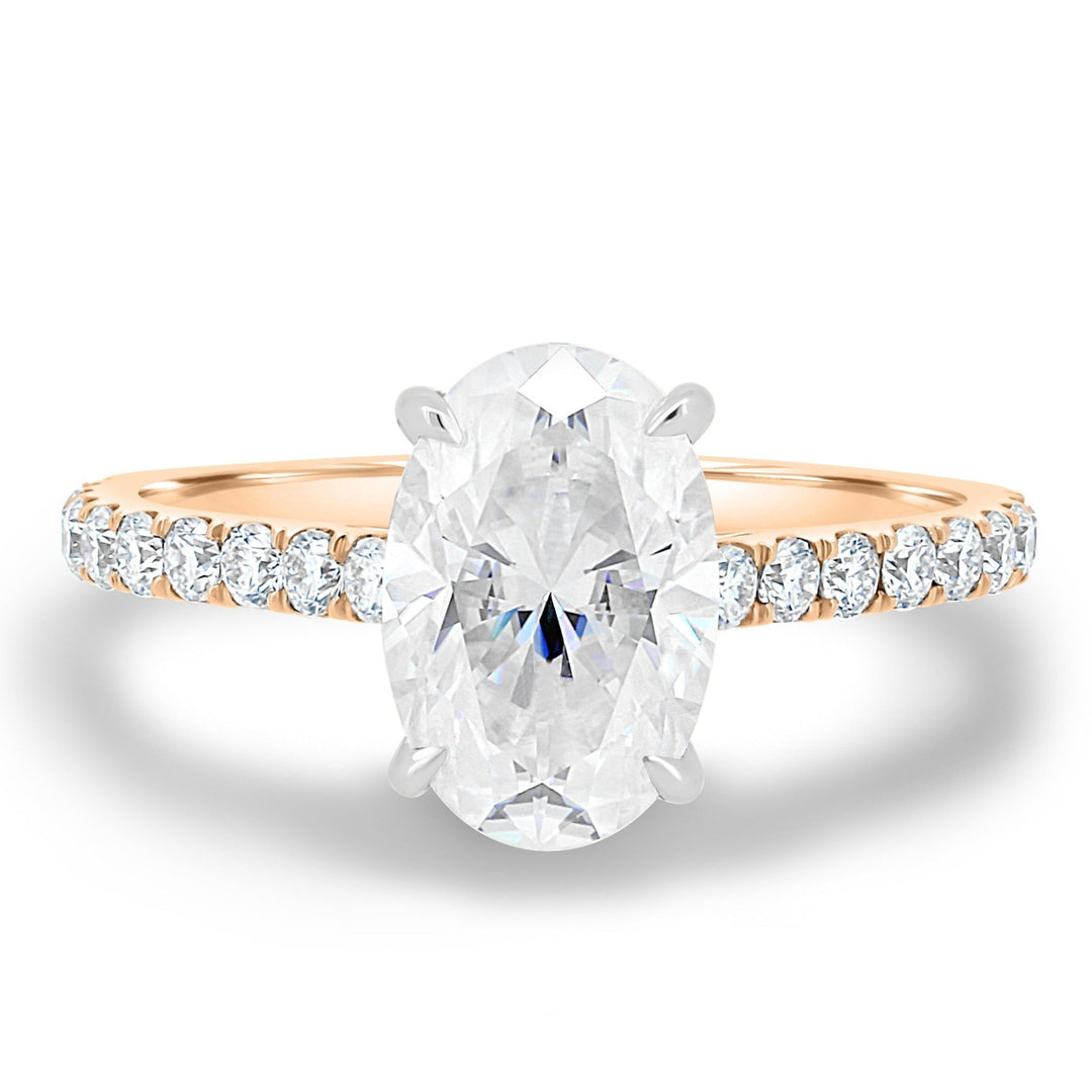 Oval hidden halo engagement ring close-up highlighting diamond sparkle