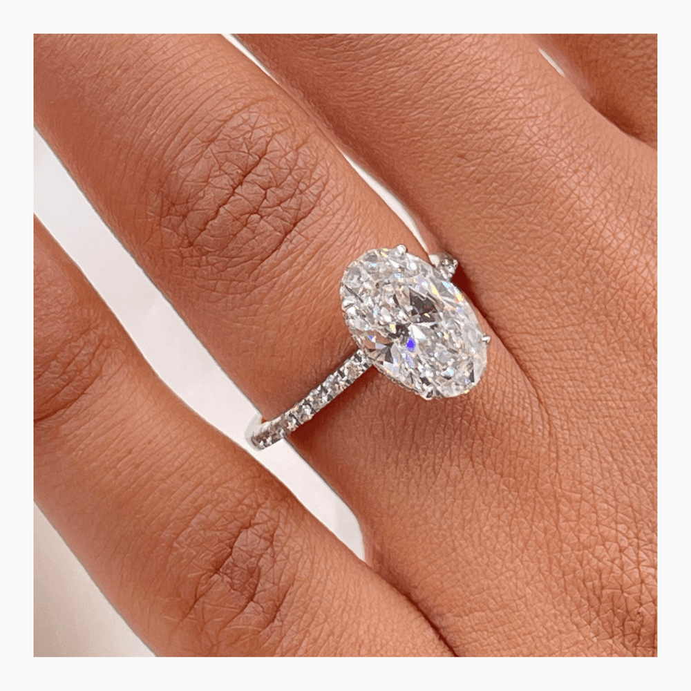Oval pave lab grown diamond ring fitted on finger