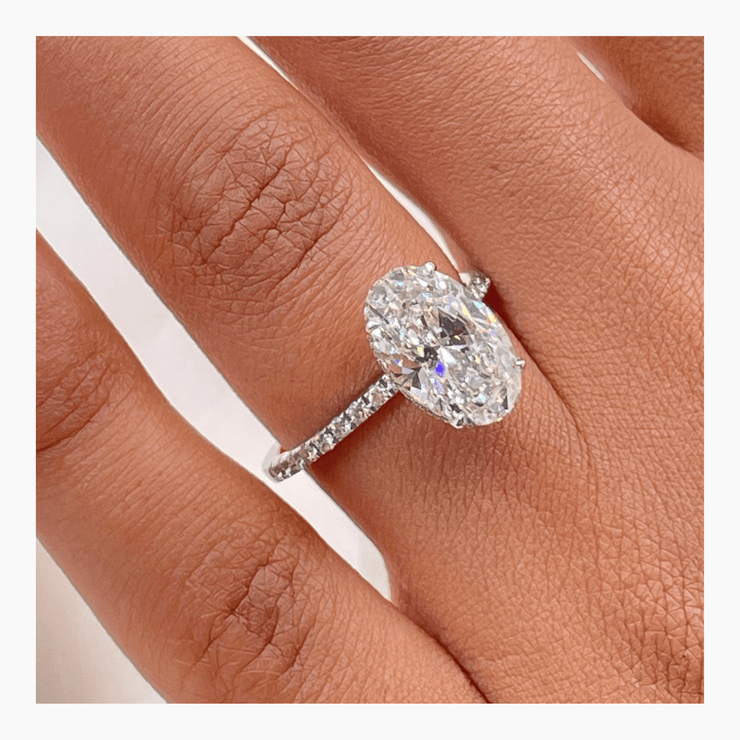 Oval pave lab grown diamond ring fitted on finger