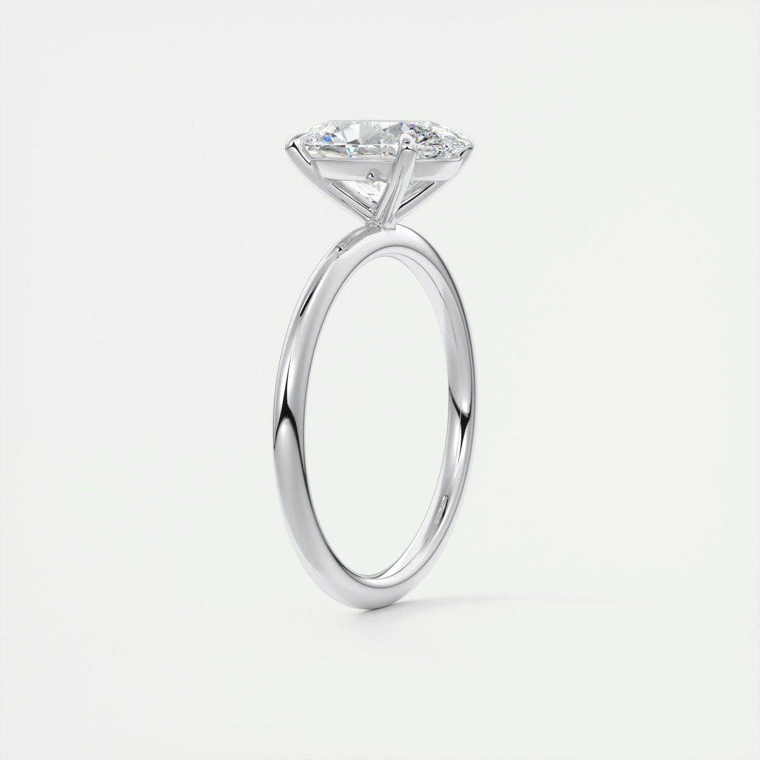 Oval solitaire engagement ring shown on hand for true-to-life sizing