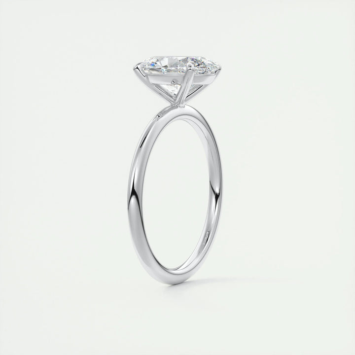 Oval solitaire engagement ring shown on hand for true-to-life sizing