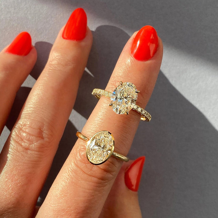 Oval pave engagement ring offered in gold and platinum