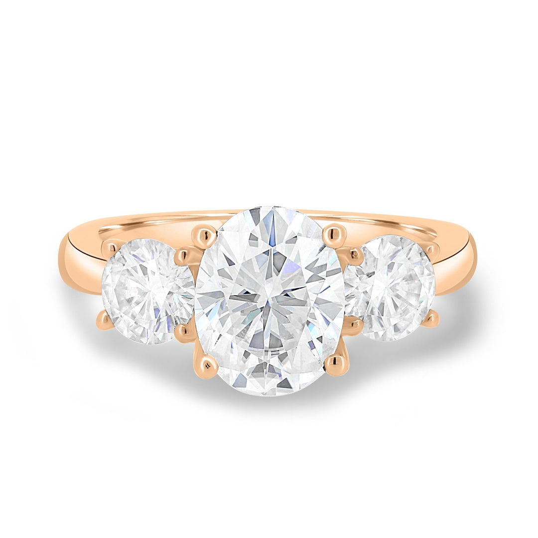 Oval three stone engagement ring shown on hand for true-to-life sizing