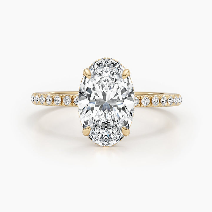 Oval cut pave engagement ring shown in real-life wear