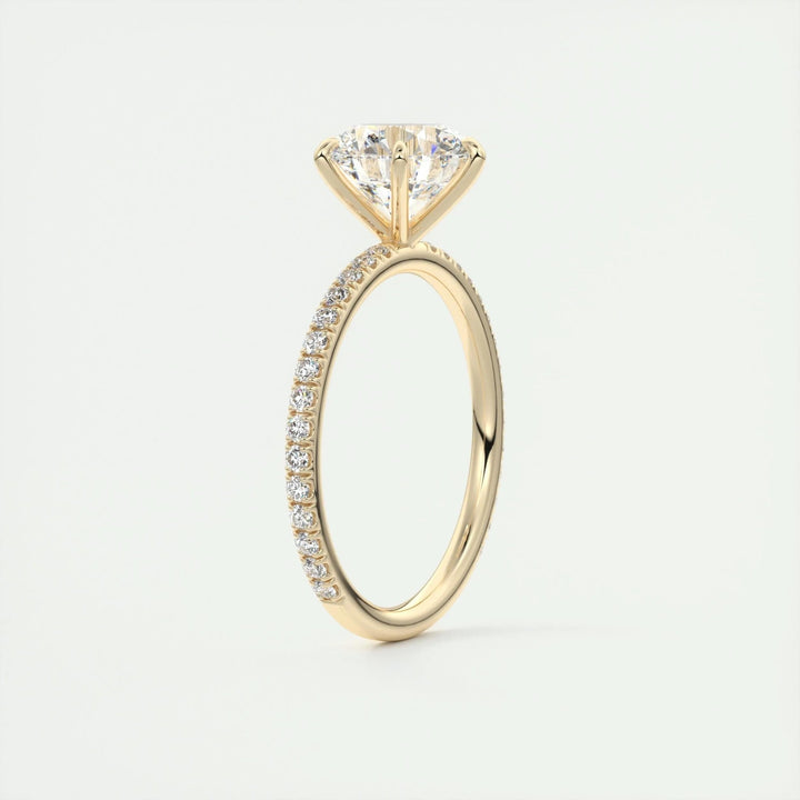 Round pave engagement ring close-up showing F-/VS1 diamond clarity