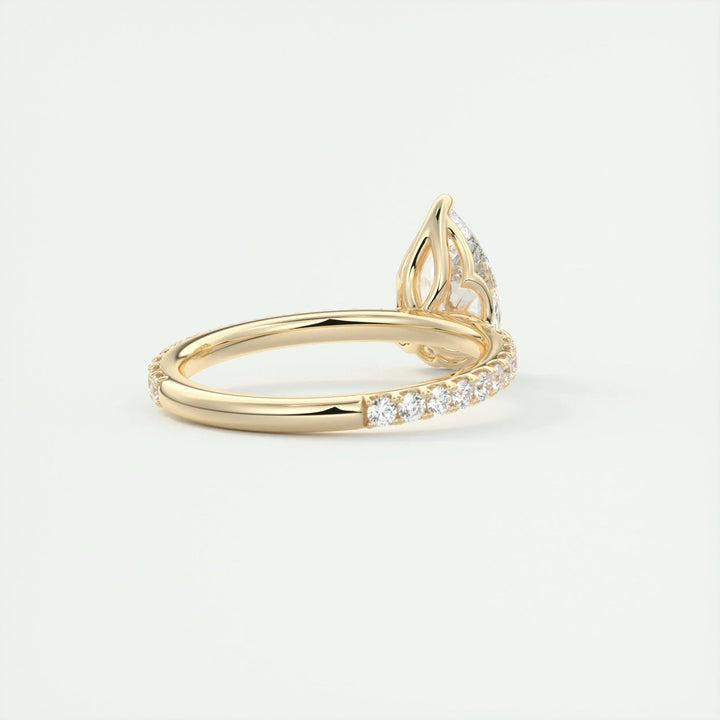 Pear pave engagement ring finished in polished solid gold