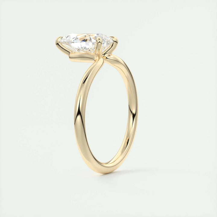 Pear solitaire lab grown diamond ring side profile in gold setting