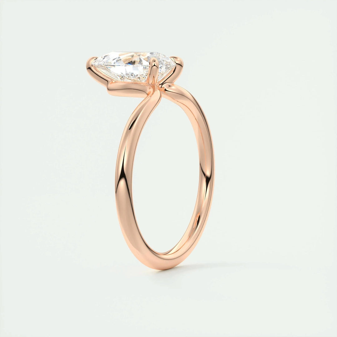 Pear solitaire lab grown diamond ring fitted on finger