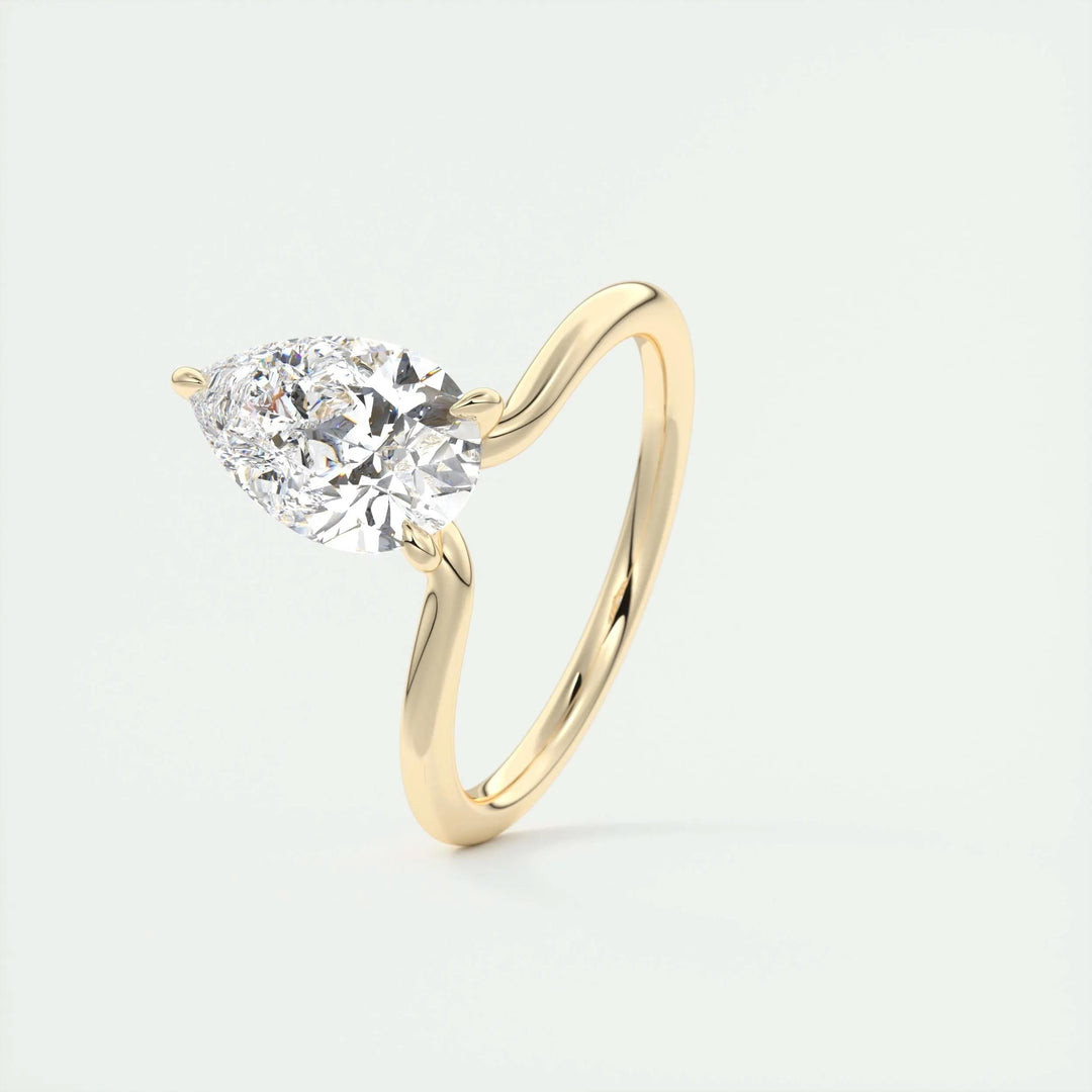 Macro shot of pear cut diamond facets in solitaire ring setting