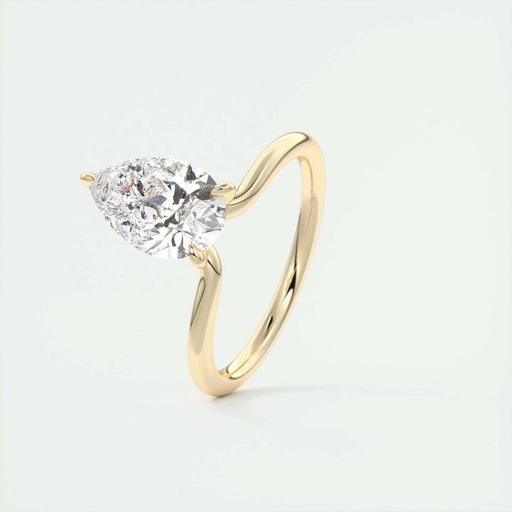 Macro shot of pear cut diamond facets in solitaire ring setting