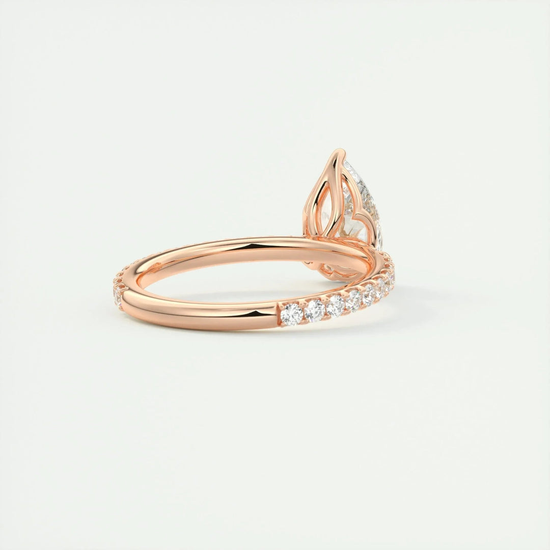 Pear pave engagement ring close-up highlighting diamond sparkle
