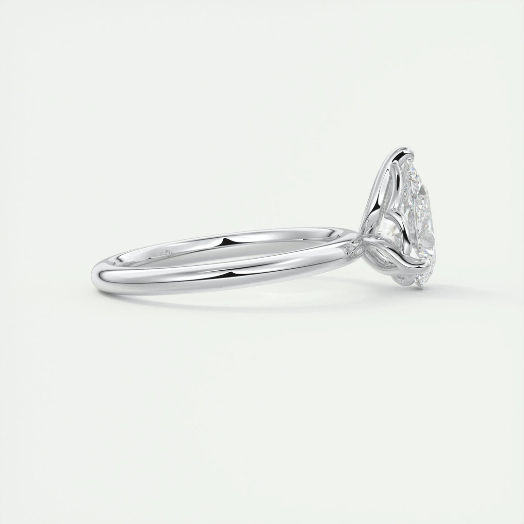 Pear solitaire diamond ring displayed on jewelry stand