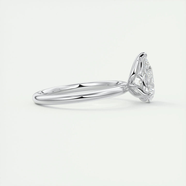 Pear solitaire diamond ring displayed on jewelry stand