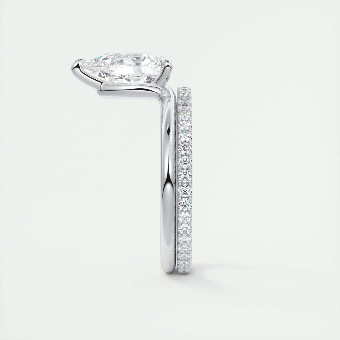 Pear solitaire diamond ring displayed on jewelry stand