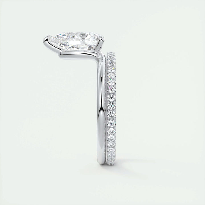 Pear solitaire diamond ring displayed on jewelry stand