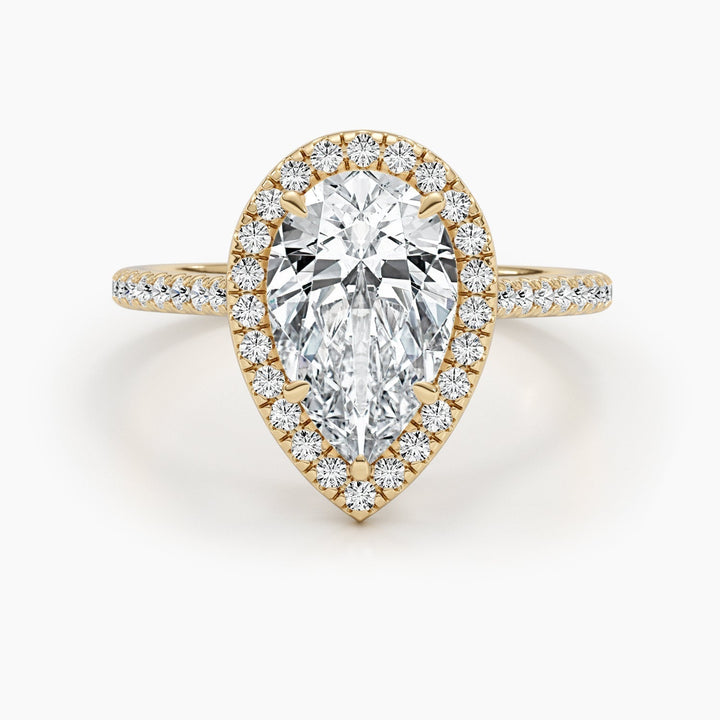 Pear halo engagement ring finished in polished solid gold