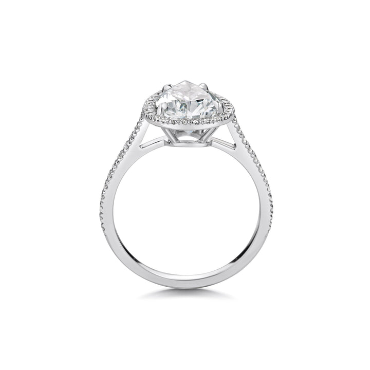 Detailed close-up of pear pave diamond engagement ring
