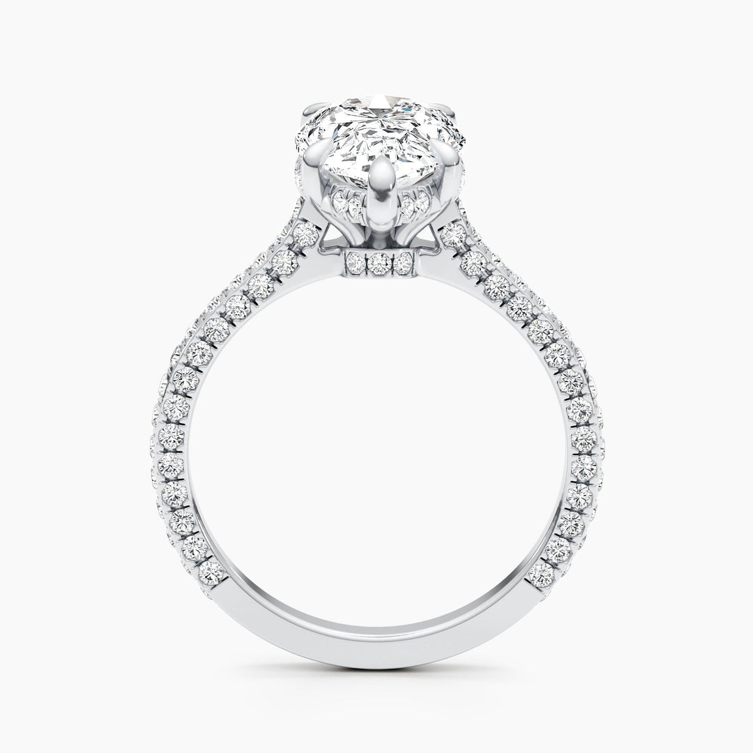 Pear hidden halo engagement ring shown on hand for true-to-life sizing