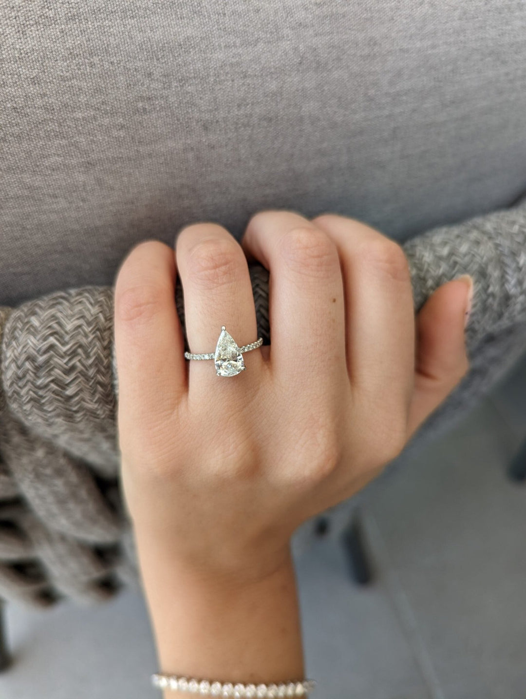 Side angle of pear pave diamond engagement ring