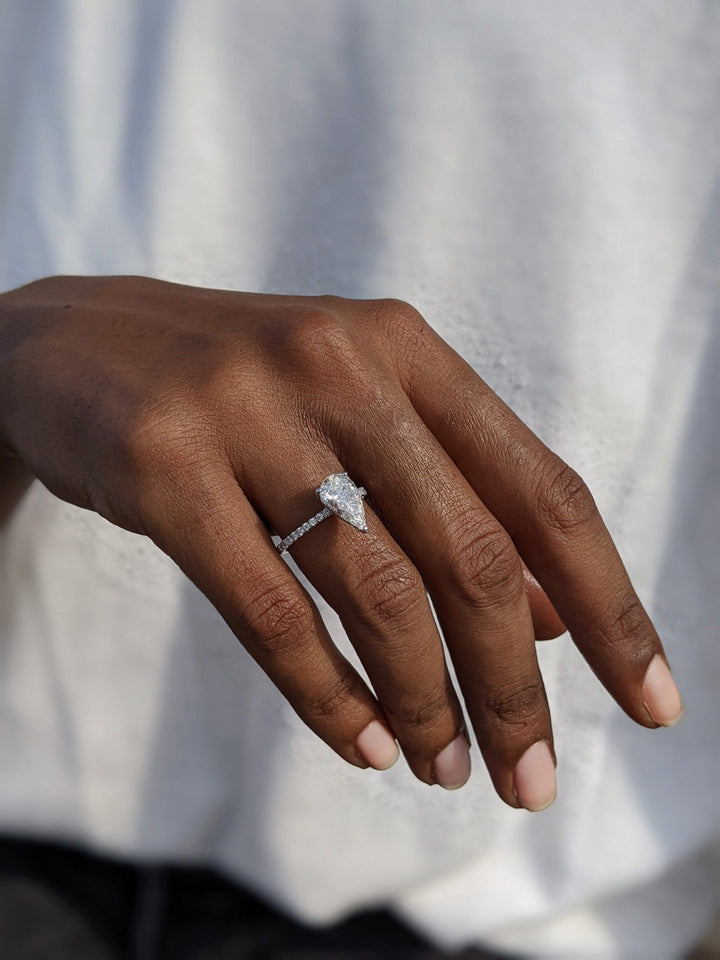 Pear pave engagement ring viewed from the side