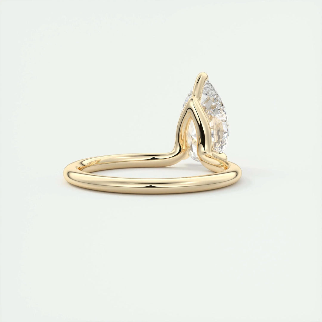 Close-up of pear cut center diamond in solitaire engagement ring