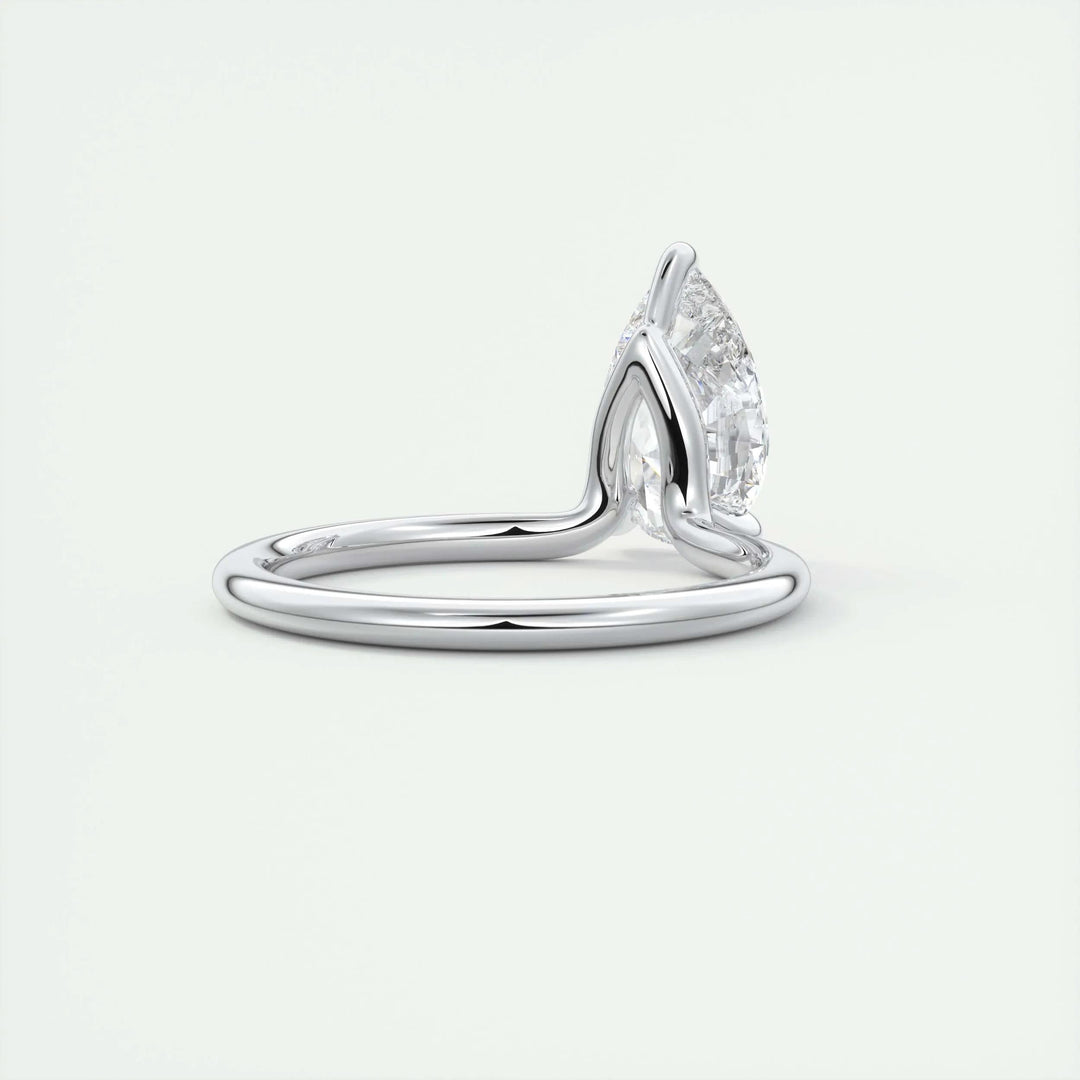 Pear solitaire engagement ring photographed in natural light
