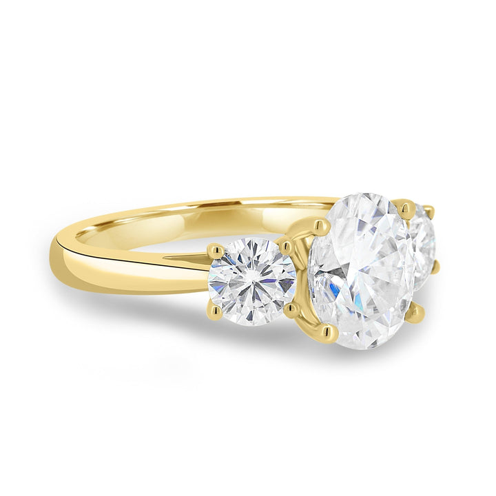 Side angle of oval three stone diamond engagement ring