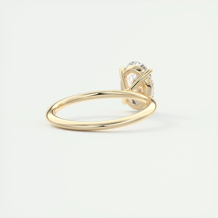 Lifestyle shot of oval solitaire diamond ring on hand