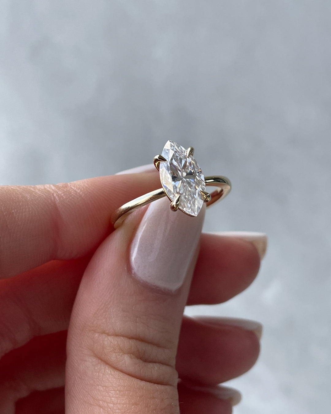 IGI certified marquise cut diamond in solitaire engagement ring setting