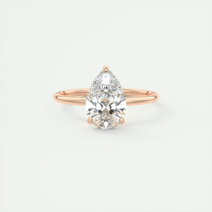 Pear solitaire lab grown diamond ring fitted on finger