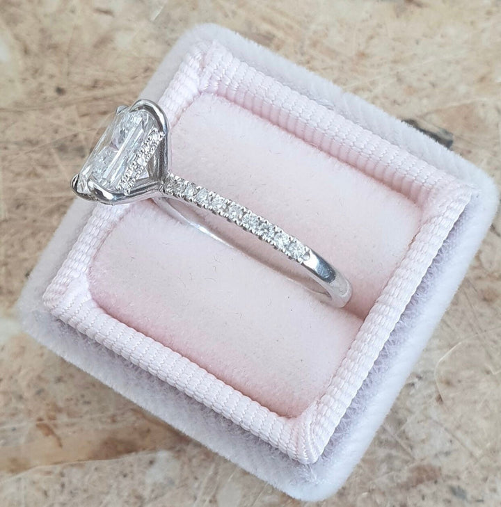 Unboxing view of radiant cut hidden halo diamond engagement ring