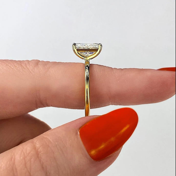 Certified emerald cut diamond featured in solitaire engagement ring
