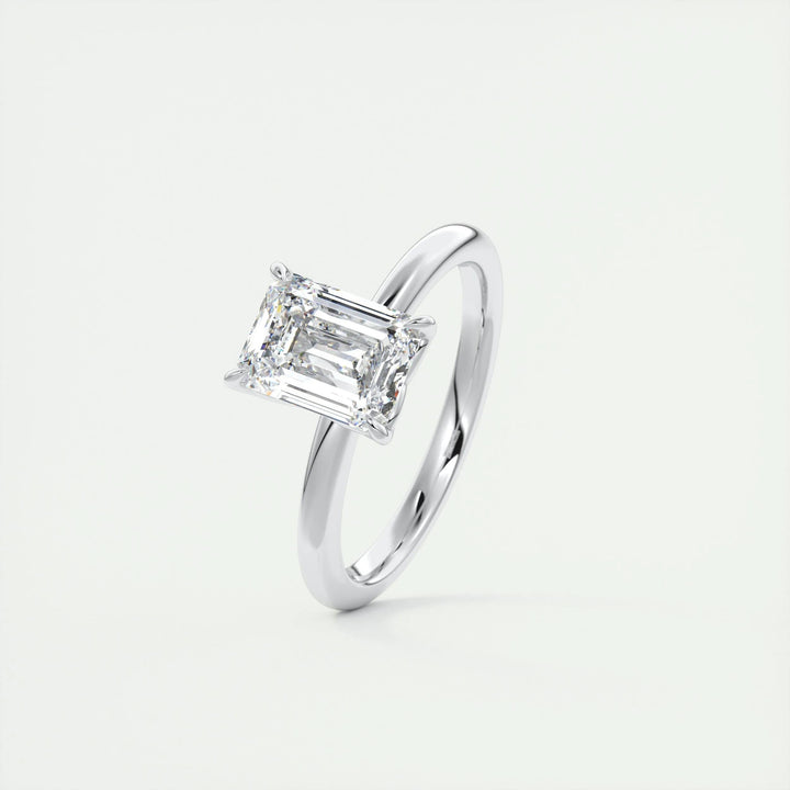 Emerald solitaire lab grown diamond ring side profile in gold setting