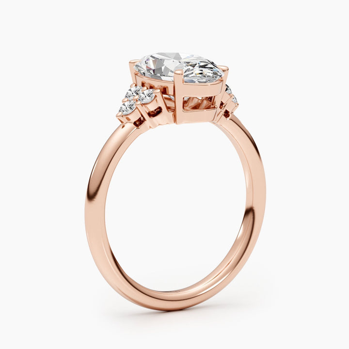 Angled view of oval cut diamond in cluster setting
