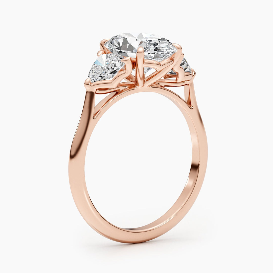 Certified oval cut diamond featured in three stone engagement ring