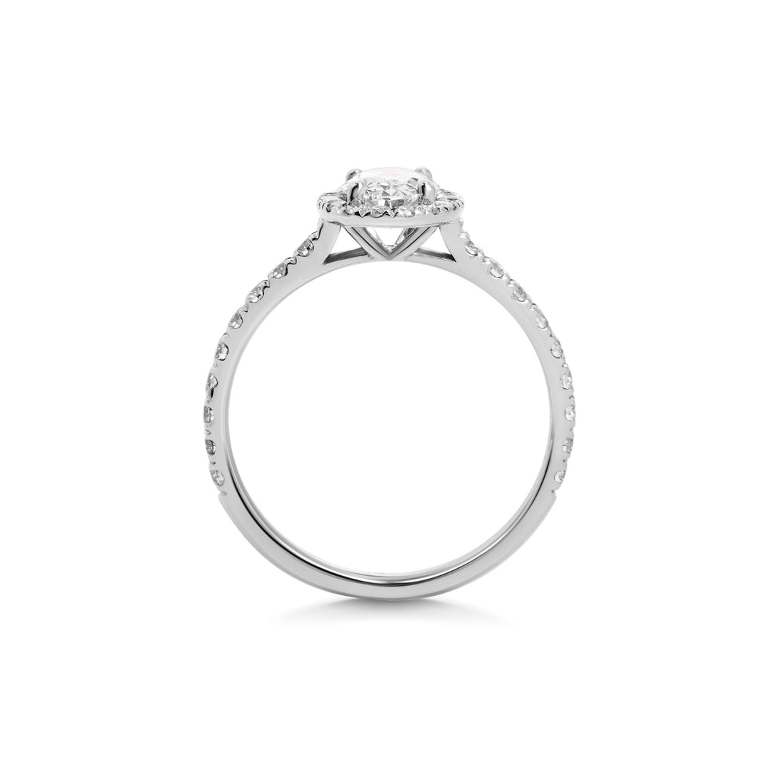 Angled view of oval cut diamond in pave setting
