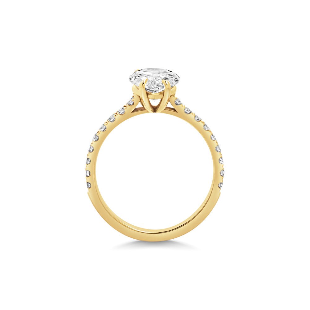 Pear pave diamond ring displayed on jewelry stand