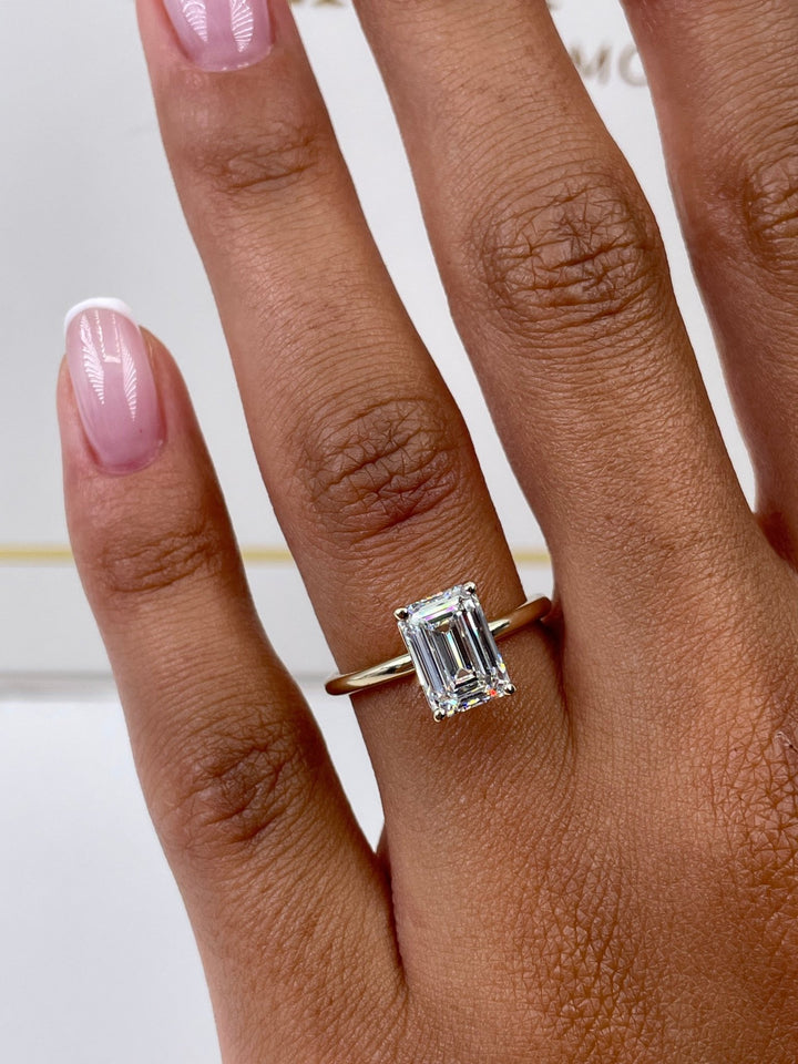 Macro shot of emerald cut diamond facets in solitaire ring setting