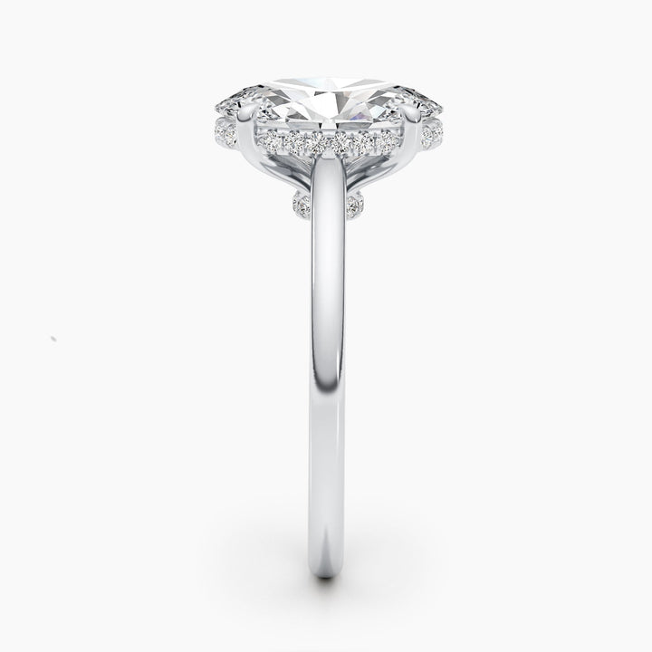 Fine craftsmanship detail on oval hidden halo engagement ring