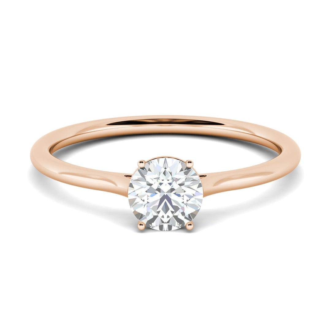 Round solitaire engagement ring close-up showing F-/VS2 diamond clarity
