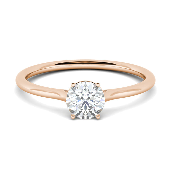 Round solitaire engagement ring close-up showing F-/VS2 diamond clarity