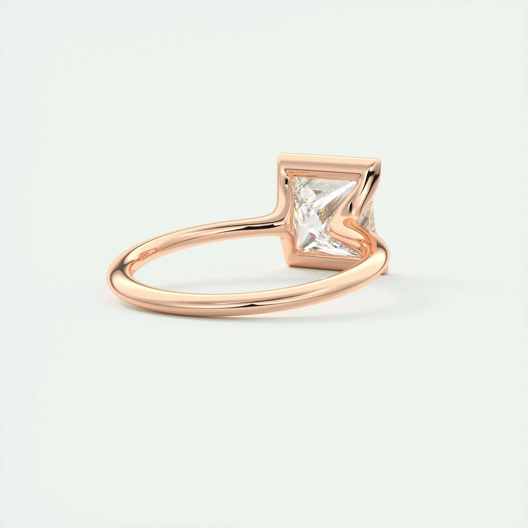 Princess solitaire diamond ring displayed on jewelry stand