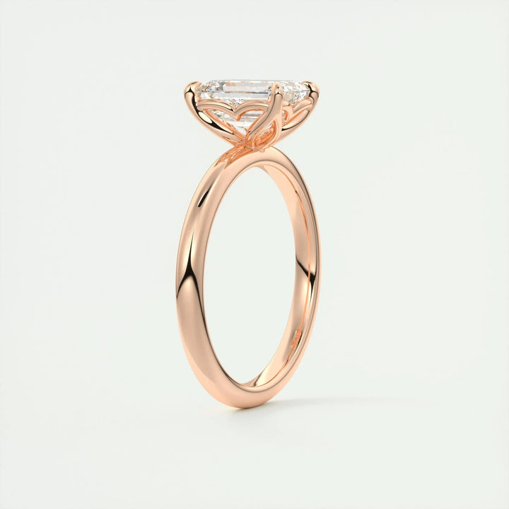Emerald solitaire diamond engagement ring available in multiple metals